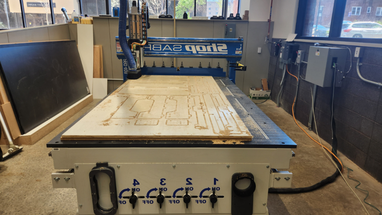 A CNC router cutting out a sleeping platform prototype
